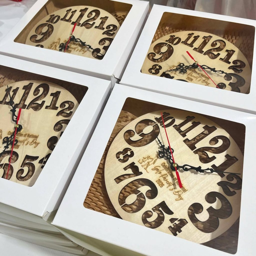 Laser-cut plywood clocks packed in gift boxes