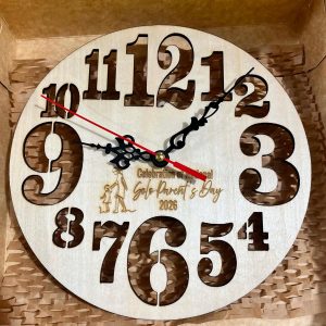 Laser-cut plywood wall clock with engraved design